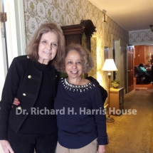 Gloria Steinem, political/social activist (L) with Valda Harris Montgomery (R) at the Harris House. Social activist, Ruby Sales seated in the background with turquoise blouse.
